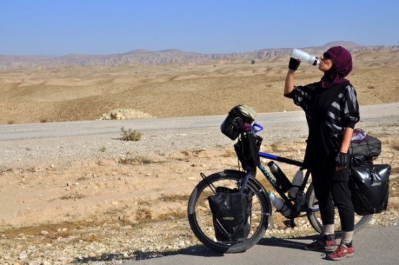 Cycling with a backpacker who bought a bicycle, and made this photo of me.