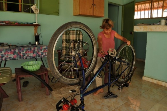 Checking, and repairing the bicycle, early morning before a wash