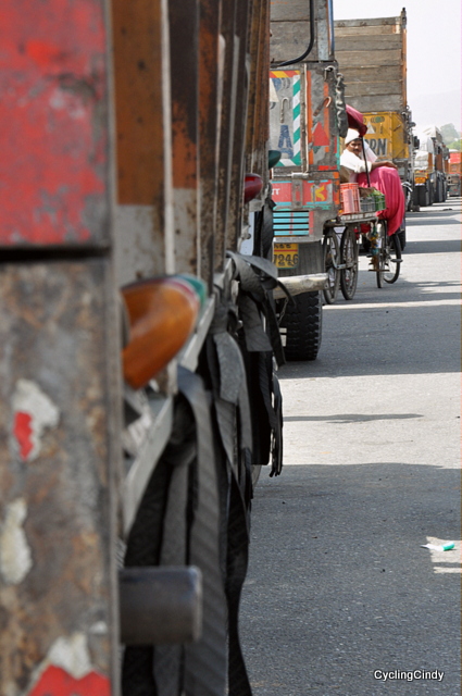 Kulfi Hiding Between Trucks