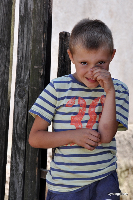 A very shy kid, understandable when suddenly a tourist stands right in front you