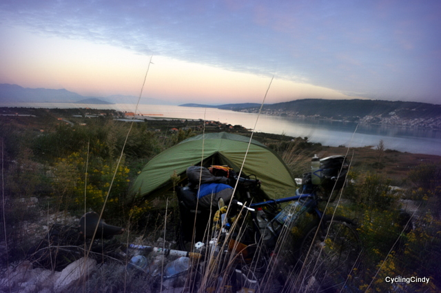 A very stealthy camp, right along the way, right above an airport and village