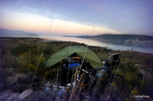 A very stealthy camp, right along the way, right above an airport and village