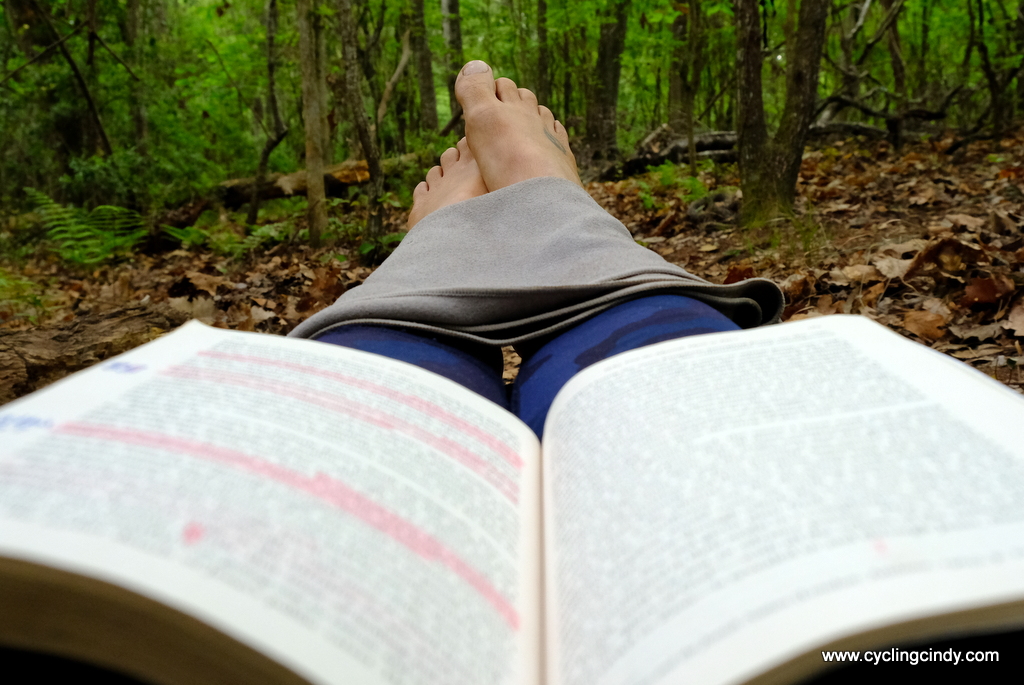 feet up, cooled and reading on
